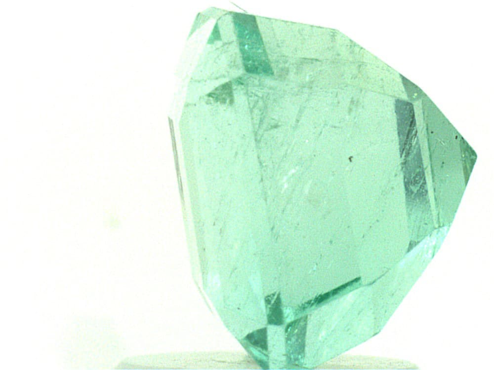Bright green Colombian emerald with emerald cut, Type-III VS2 clarity.