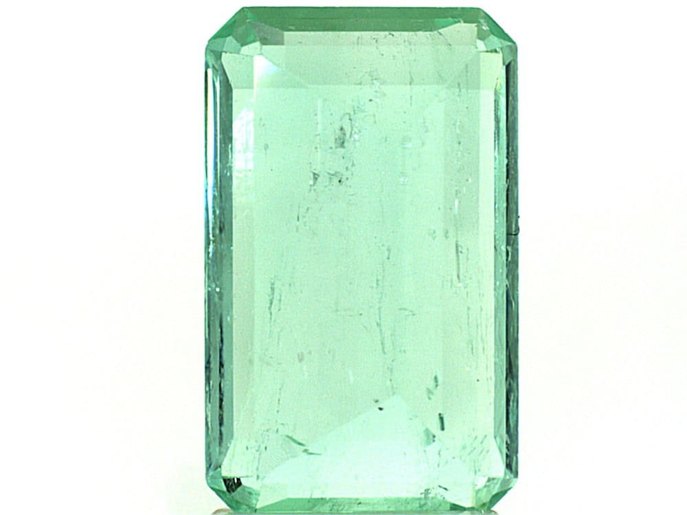Bright green Colombian emerald cut gemstone with clarity and vibrant color.