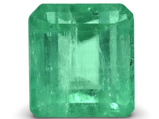 Bright green Colombian emerald cut gemstone with high clarity and brilliance.