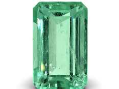 Bright green Colombian emerald cut gemstone with high clarity and brilliance.