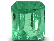 Bright green Colombian emerald cut gemstone with clarity and brilliance.