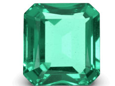 Vivid green Colombian emerald cut in an elegant rectangular shape.